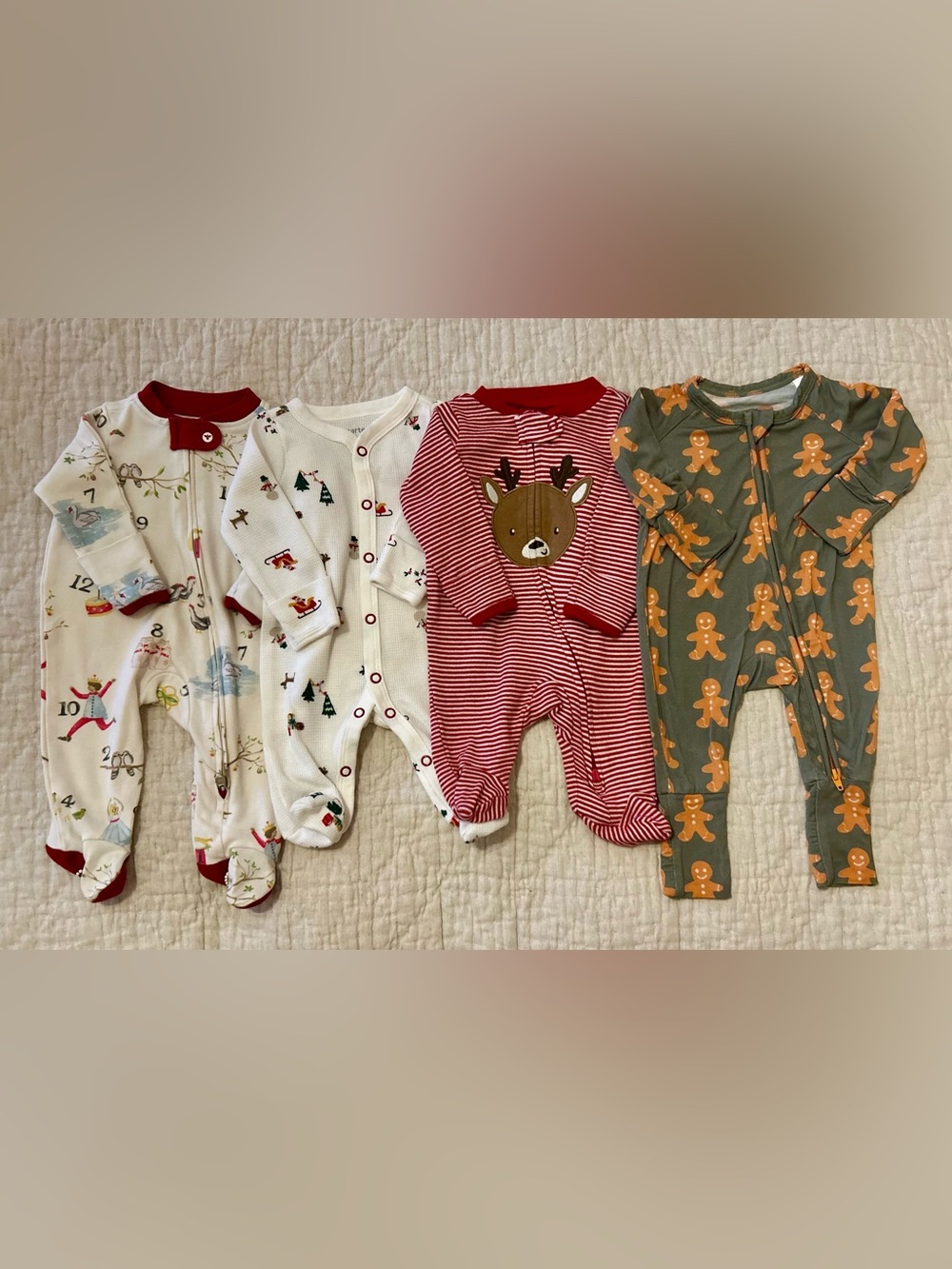 4 Holiday Footies/Romper: Burts Bees Baby, Carters and Silks size Newborn.